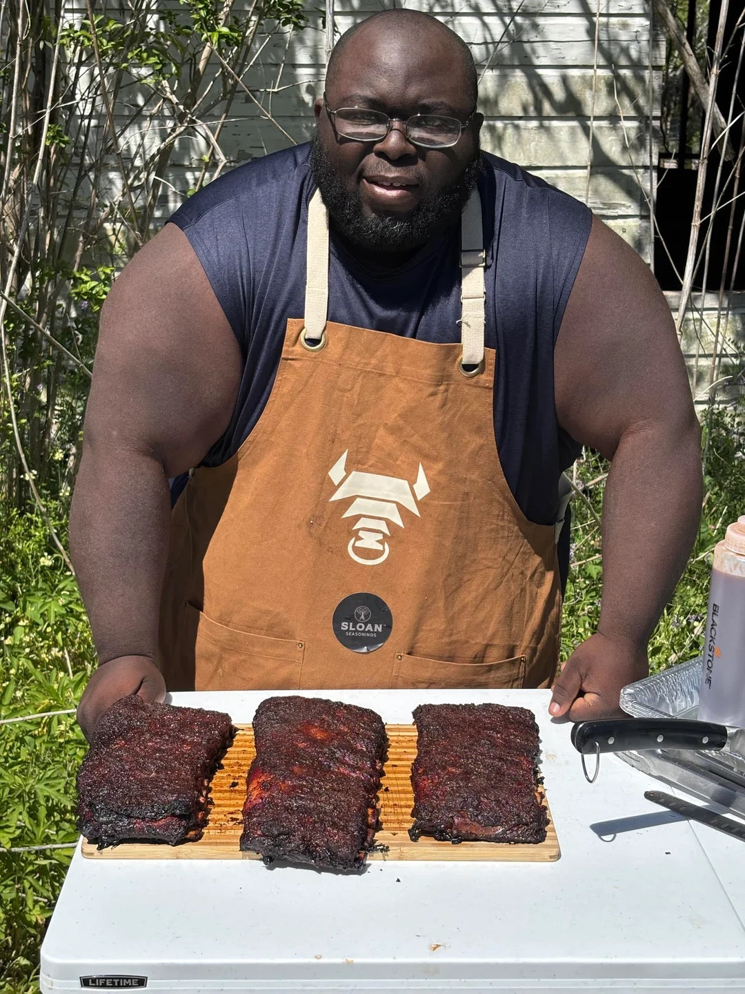 Willie Brown with ribs he prepared using the Woolly Bully for the Smoke the Station Rib Challenge in Damon, Texas.